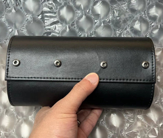 Black leather travel watch case roll, portable 3-slot organizer for secure watch storage.