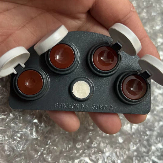 Bergeon 30180-A die-cast stand holding watch oil dip oiler for precise Swiss watch maintenance.