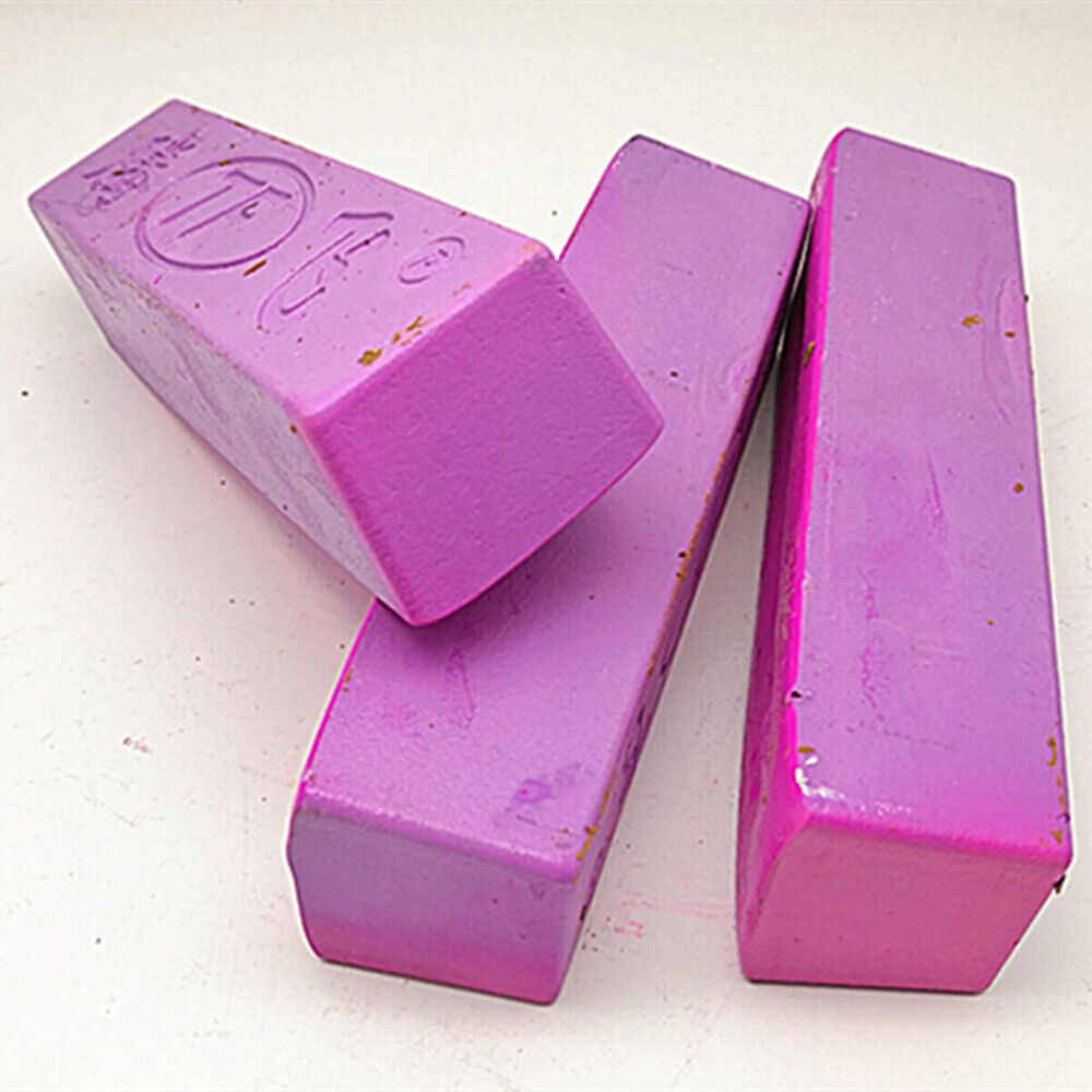 Pink stainless steel polishing compound for jewelry and watch repair, enhancing shine and surface finish.