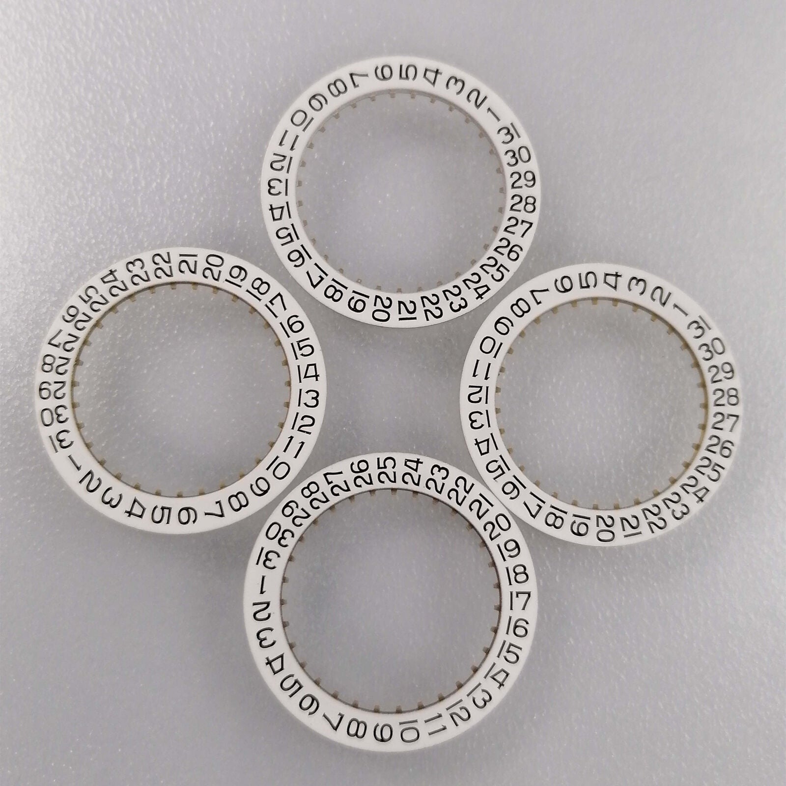 Generic white replacement date wheel for ETA2836 watch movement, date displayed at 3 o'clock position.