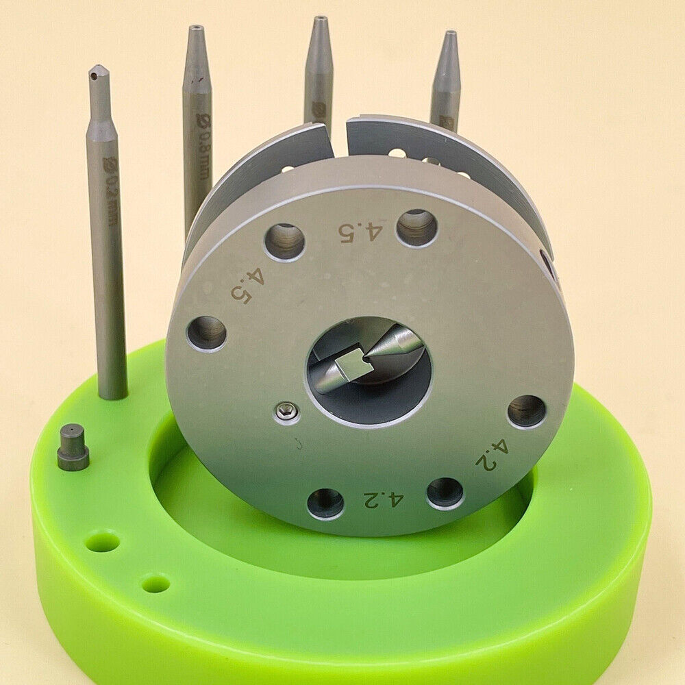 Green rotated stand for watch balance staff removal, precise tool for watchmakers.