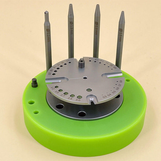 Green rotated stand for watch balance staff removal, precise tool for watchmakers.