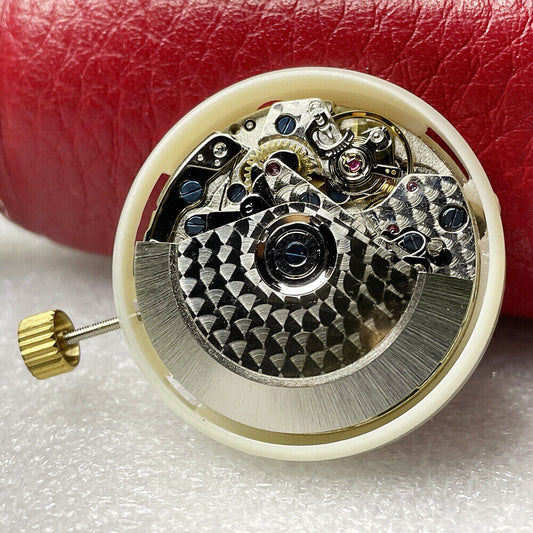 China Made 7750 chronograph watch movement with white dial, day-date, and small second at 9 o'clock by China Made.