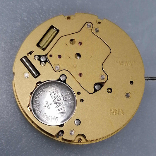 Ronda 7004N quartz watch movement with 2 hands, date at 6, day at 12, golden plated finish.