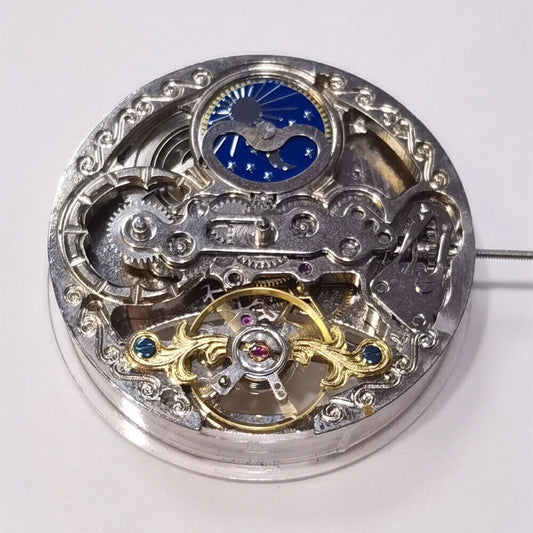 Automatic mechanical watch with silver 3 hands and hollow moon phase at 12, featuring precision movement.