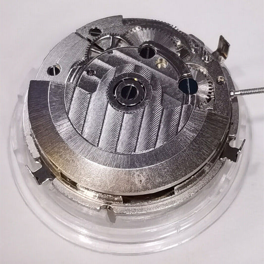 Automatic mechanical watch with silver dial, week/month display at 12, moon phase at 6, brand name included.