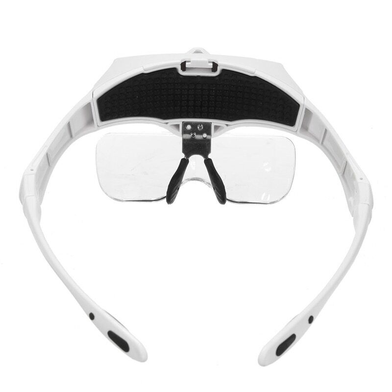 Adjustable LED reading loupe headband for jewelry and watch accessory inspection.