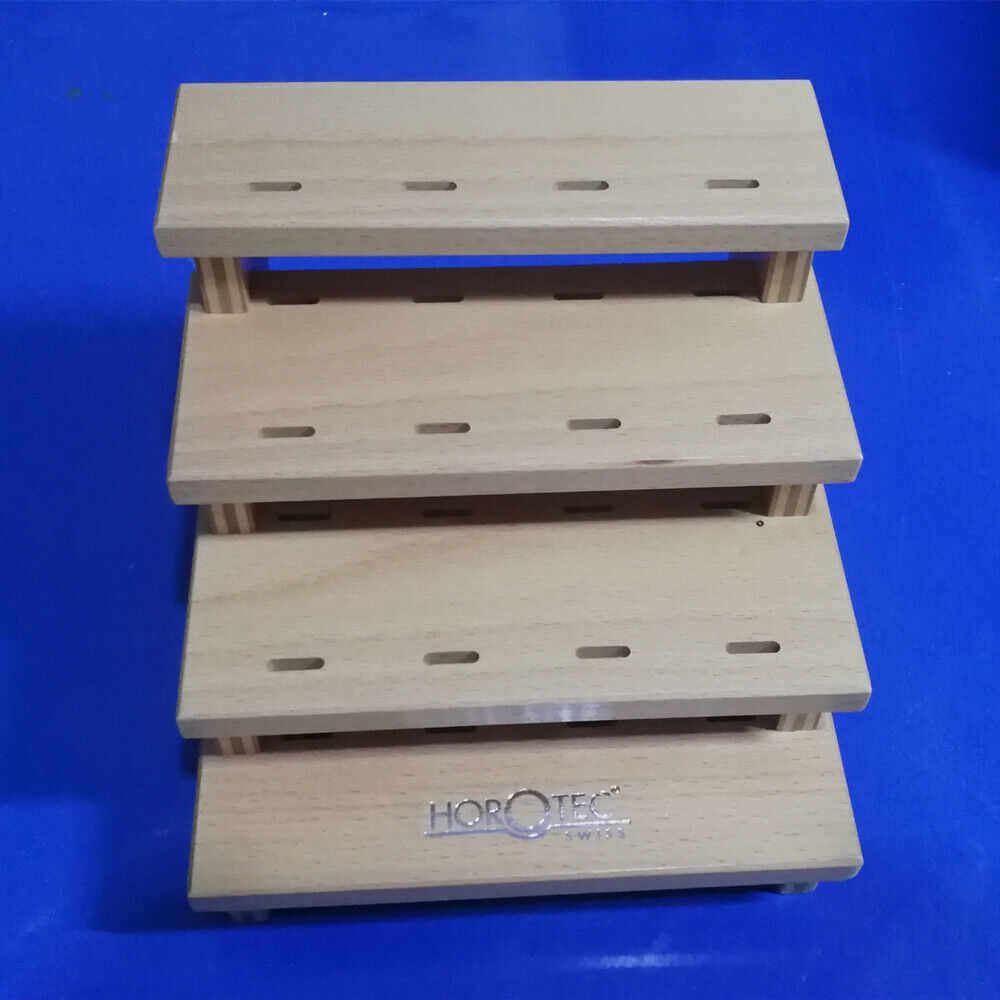 Horotec MSA12.398 wooden storage rack holding 12 tweezers, organizing watch repair tools efficiently.