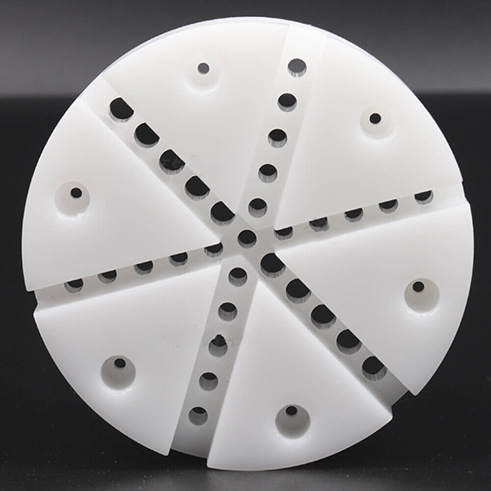 White watch band holder block with pins remover tool for watch strap repair and adjustment.