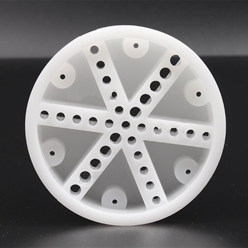 White watch band holder block with pins remover tool for precise watch strap repair.