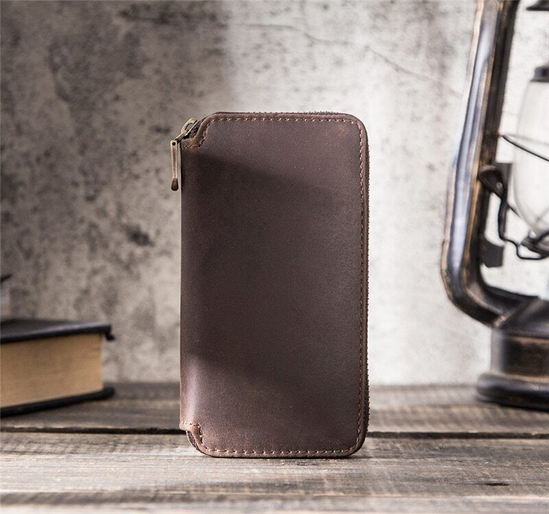 Brown leather 2-slot watch box, luxury travel pouch with zipper for secure watch storage.