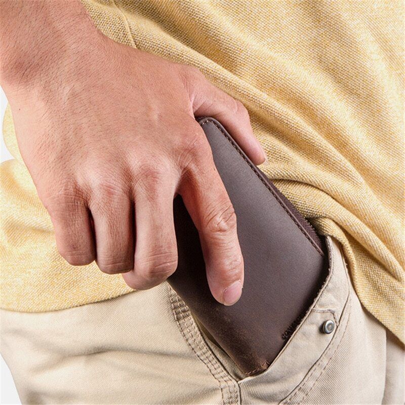 Brown leather 2-slot watch box, luxury travel organizer with zipper pouch for secure watch storage.