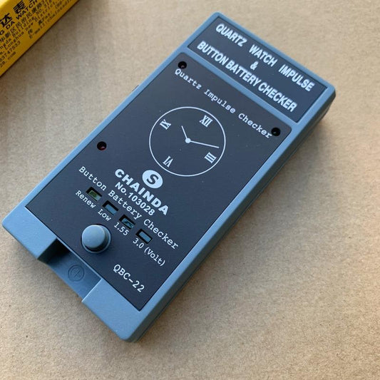 QBC-22 Quartz Watch battery tester by QBC, compact tool for accurate watch battery diagnostics.