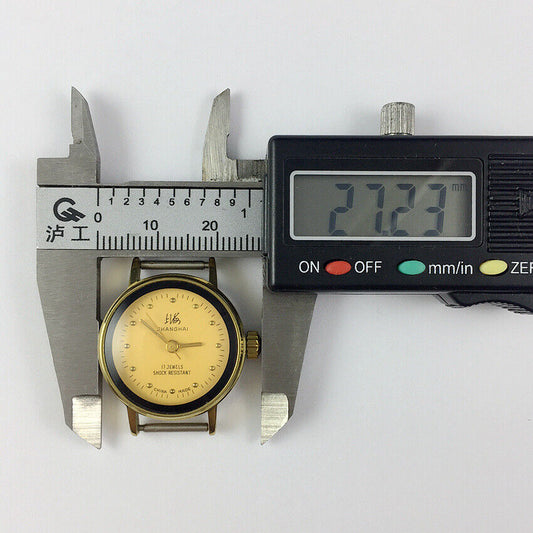 Lady's 25mm China-made manual mechanical watch with 17 jewels, yellow dial, and gold-tone nails.
