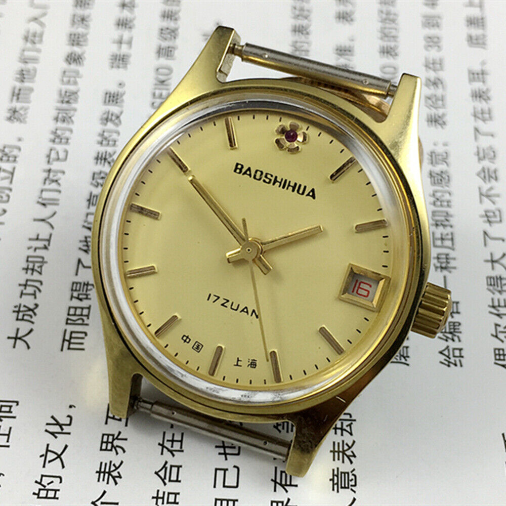 Yellow dial 33mm manual mechanical watch with single calendar and 17-jewel shock-resistant movement.