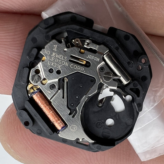 Hattori Epson VX33E quartz watch movement, precision Japanese craftsmanship for watch repairs.