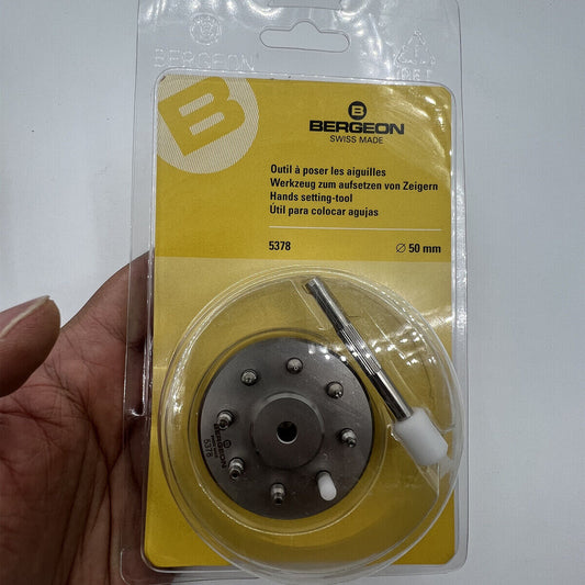 Bergeon 5378 Swiss watch hand fitting tool with 9 stakes on holder for precise assembly.