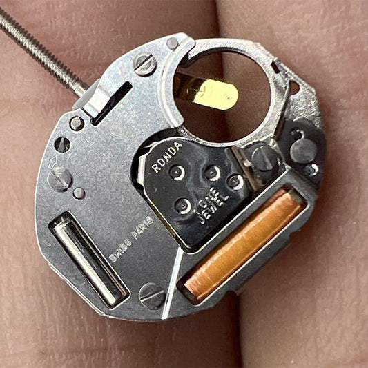Ronda 753 quartz watch movement with high canon pinion, Swiss parts for precise timekeeping.