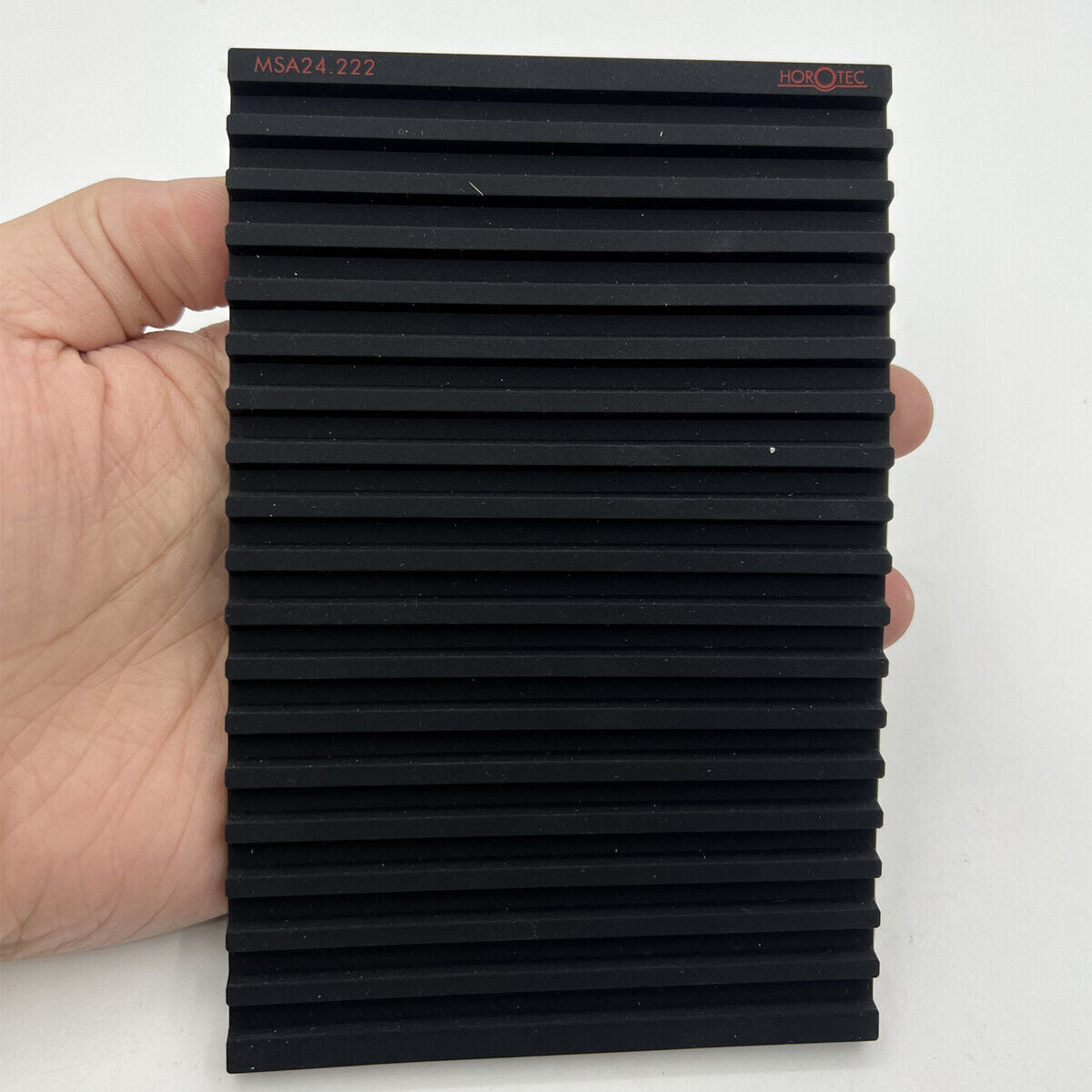 Horotec MSA24.222 black silicone bench mat with 19 grooves for secure watch repairs and parts organization.
