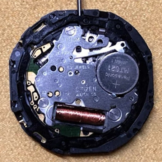 Citizen E101M Eco-Drive watch repair part with Japan-made movement and date display at 3 o?clock.