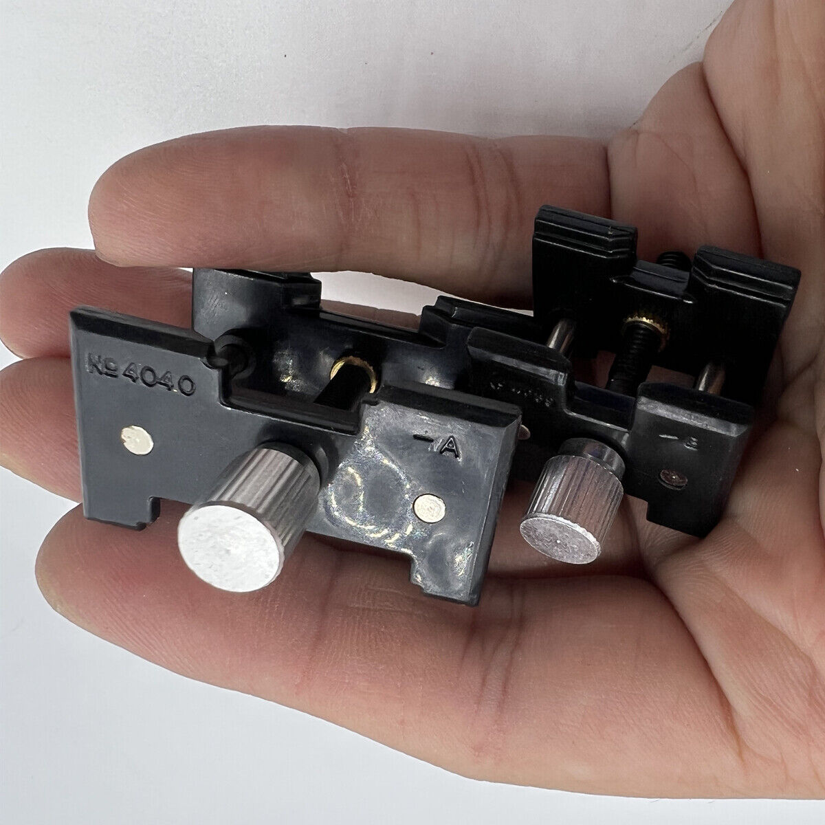 Durable 4040-P reversible movement holder clamp by China, ideal for precise watch repair tasks.