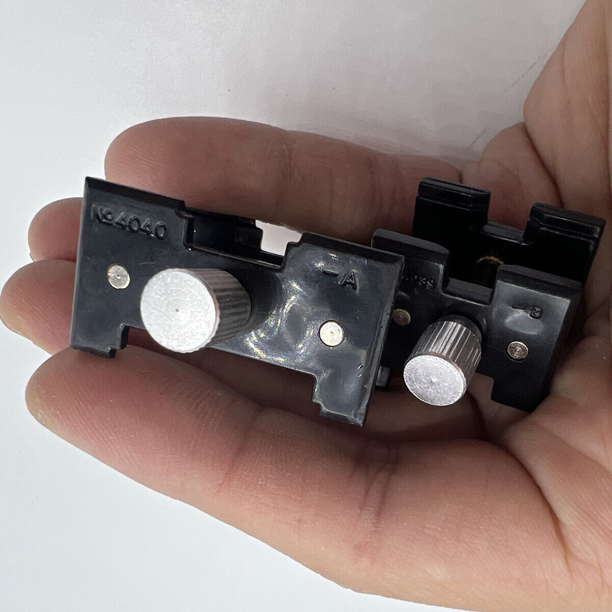 Durable China-made reversible movement holder clamp 4040-P for precise watch repair.