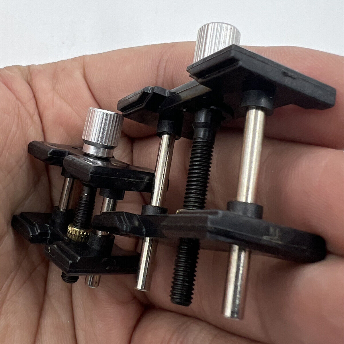 Durable 4040-P reversible movement holder clamp by China for precise watch repair tasks.