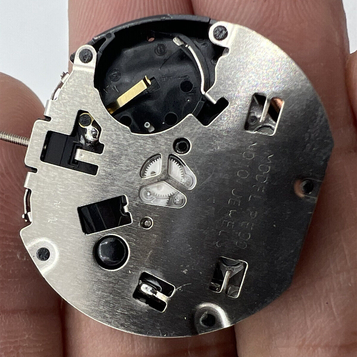 Sunon PE90 quartz watch movement featuring three hands with small seconds displayed at 6, 9, and 12 o?clock positions.