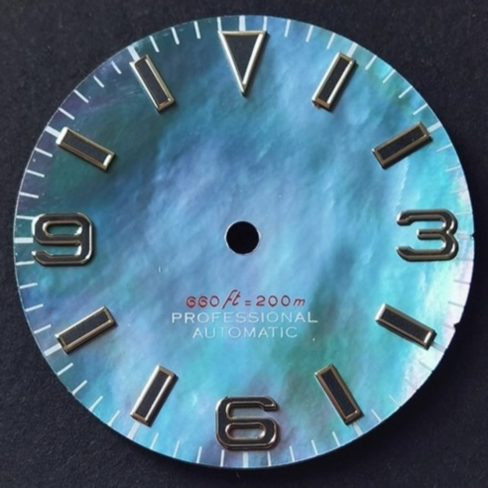 Dark green 28.5mm modified NH35 watch dial with natural seashell vein and green lume.