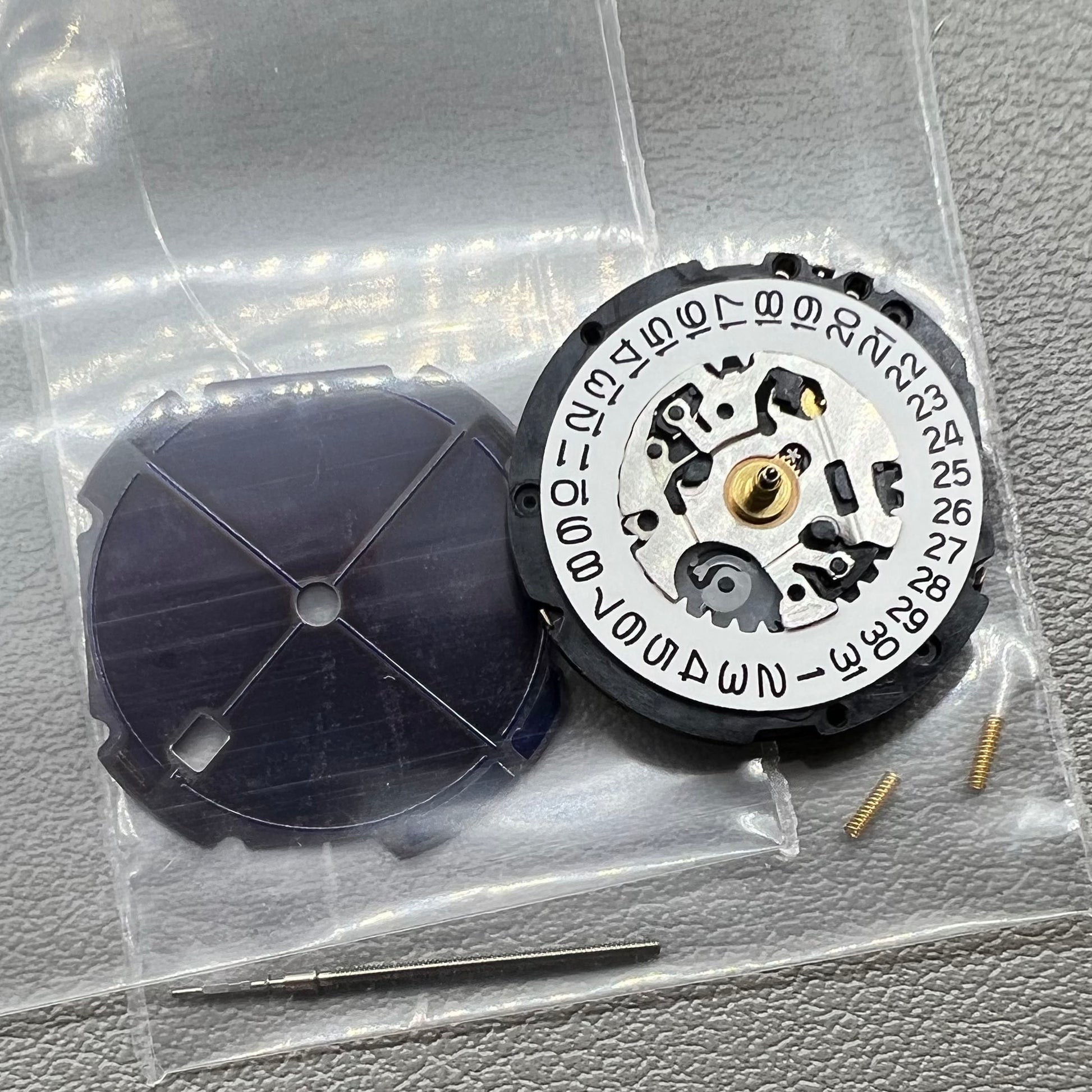 Seiko V187 quartz watch movement showcasing precision timekeeping components.