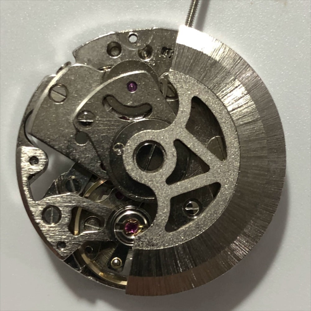 China Made 7120 silver watch with hollow 3-hand automatic mechanical movement by Automatic Fork, elegant design for watch enthusiasts.