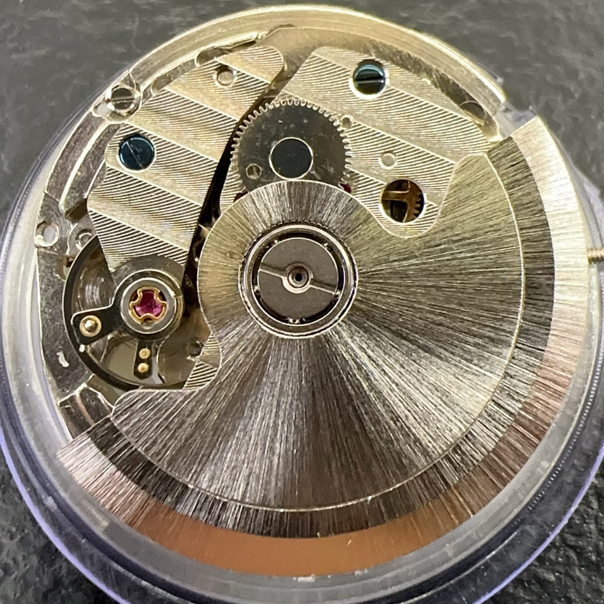 China Made 2242 automatic watch movement with single calendar and small second hand, precision timekeeping component.