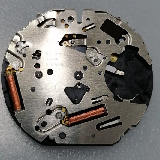 Japan Made VR31 quartz watch movement showing small second subdial at 3, 6, and 9 o'clock positions for precise timekeeping.