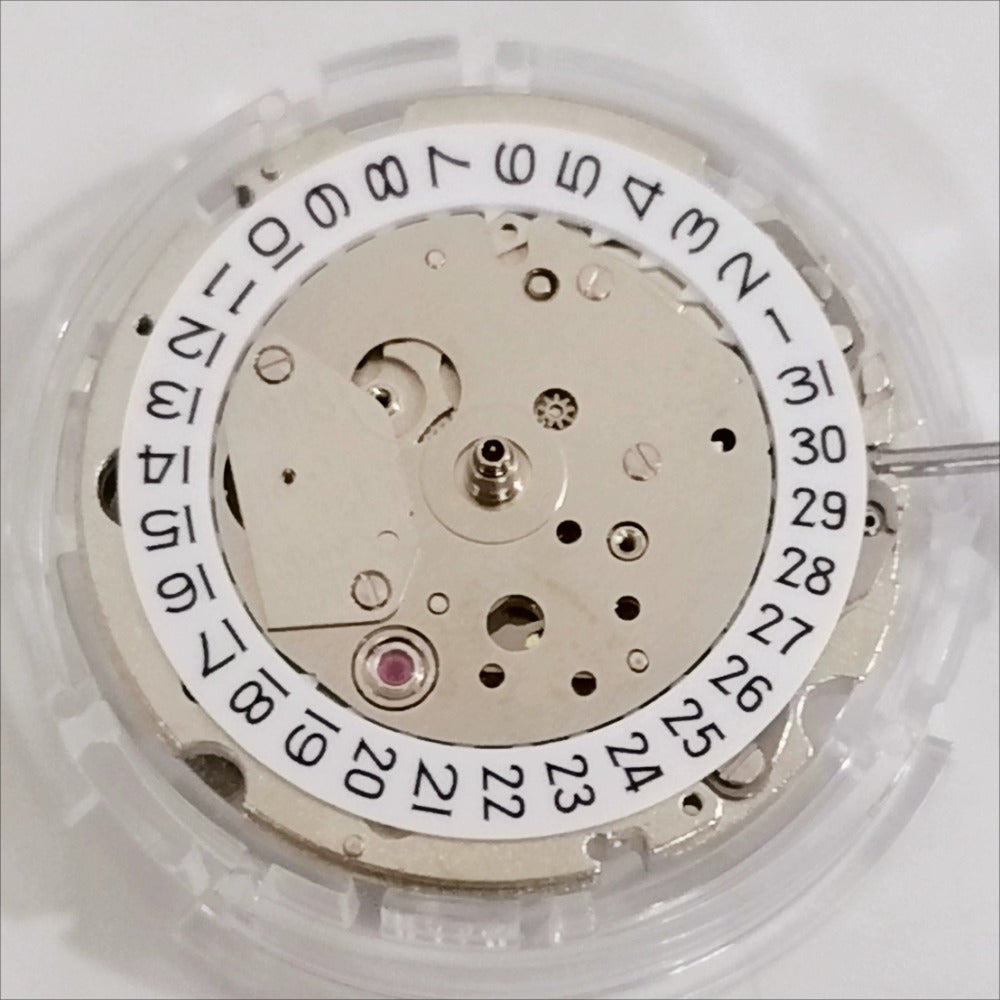 Japan Made Miyota 8217 mechanical watch movement with 3 hands, small second at 9, date at 3, precision engineered.