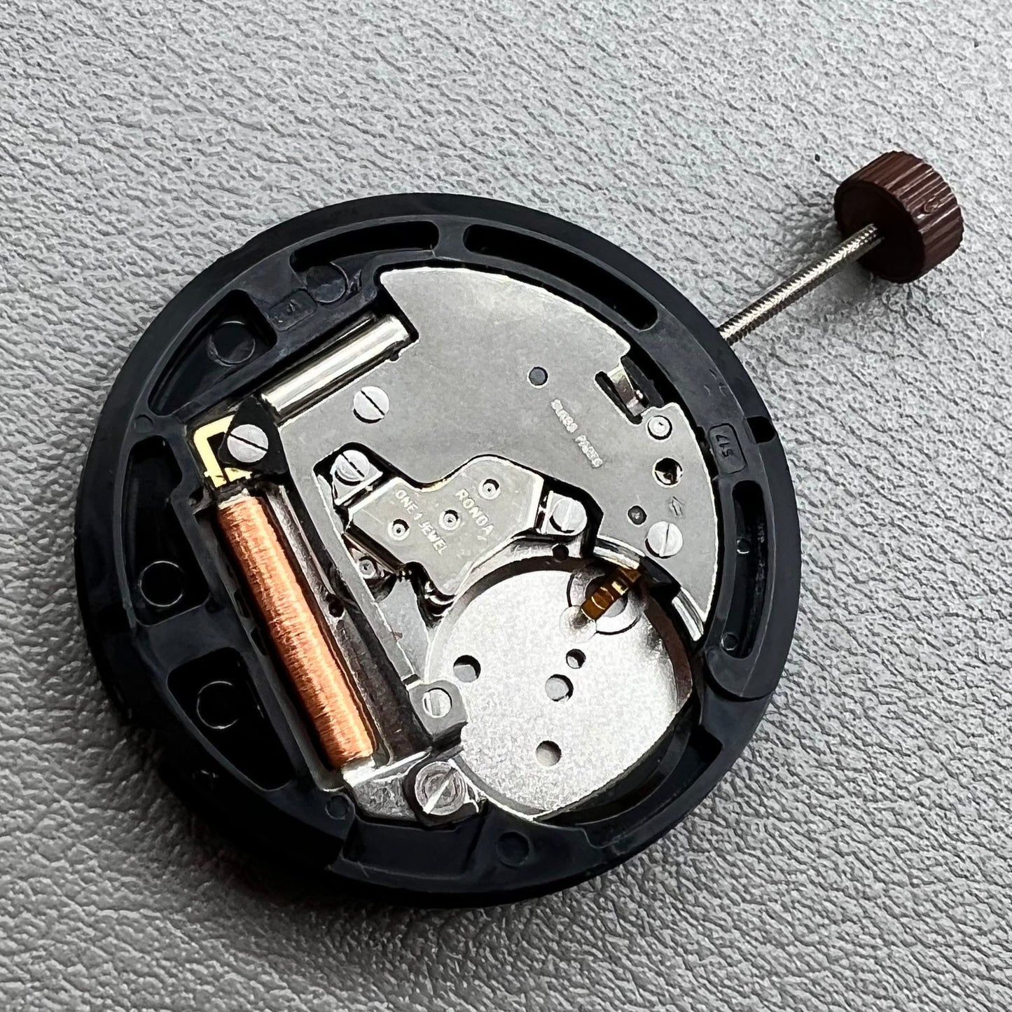 Swiss Ronda 517 quartz watch movement with day and date display at 6 o'clock, precise timekeeping.