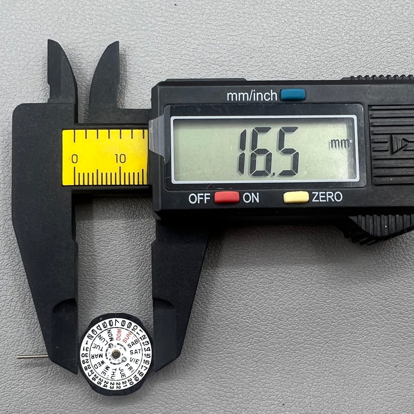 Japan PC23A Quartz watch movement showing 3 hands and double calendar functionality for precise timekeeping.