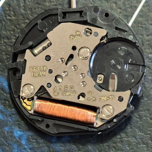 Japan Made 5F10B quartz movement watch repair part with 3 hands, precision timekeeping component.