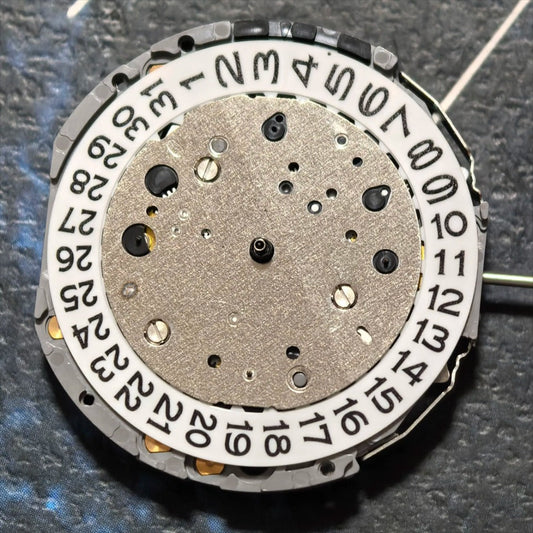 Japan Miyota JS25 quartz watch movement with small second subdials at 3, 6, and 9 o'clock positions.