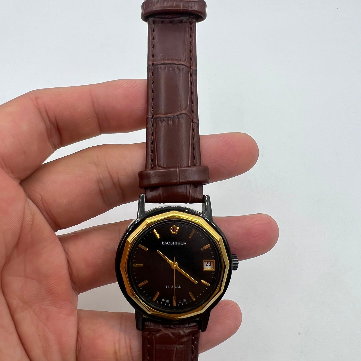 Classic 37mm Shanghai manual mechanical watch with single calendar, black case, and refined style for daily wear.