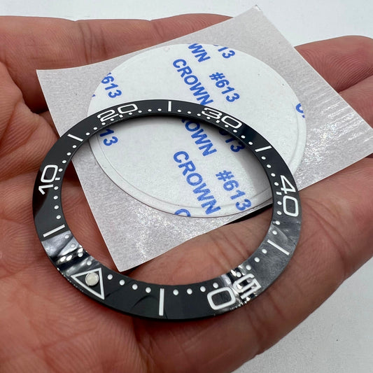 41.5mm/32.5mm ceramic watch bezel insert in black with white font, durable replacement part for watch repairs.