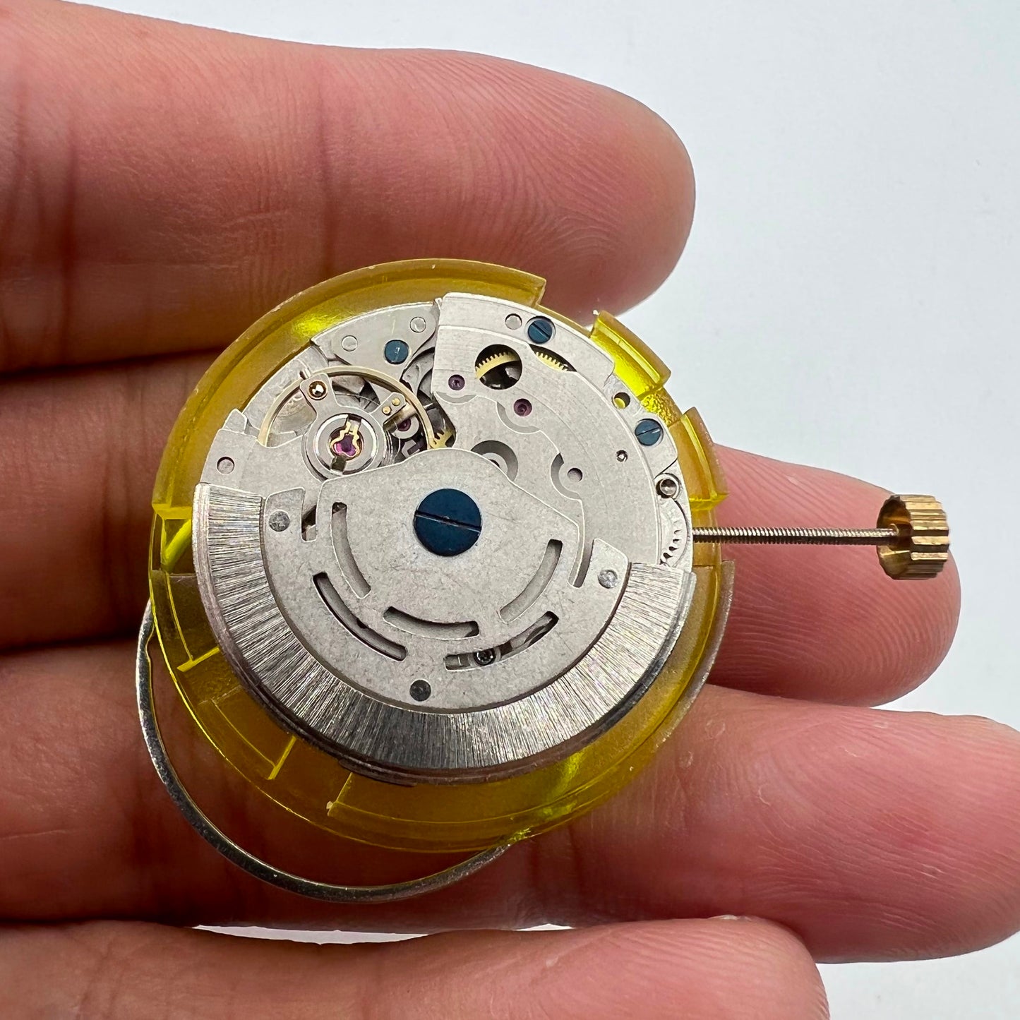 Silver China Made 2813 8205 automatic watch movement with single calendar at 3 o'clock, precise mechanism details