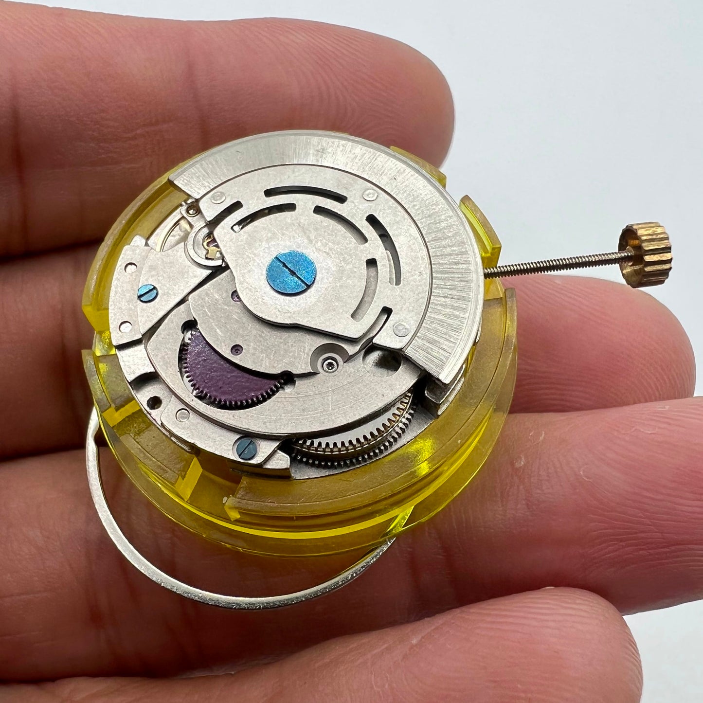 Silver China Made 2813 8205 automatic watch movement with single date calendar at 3 o'clock position, precision mechanism.