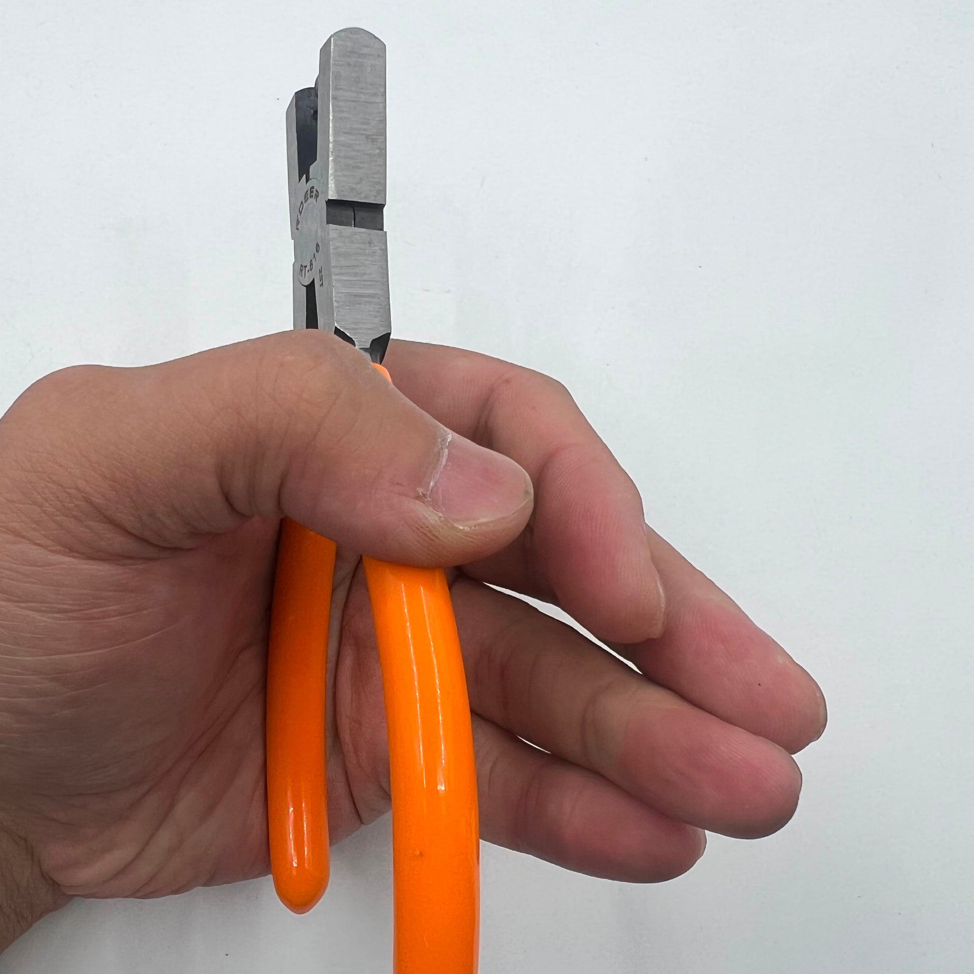 RT616 punch pliers tool creating precise 2mm holes in watch belt tags for repair tasks