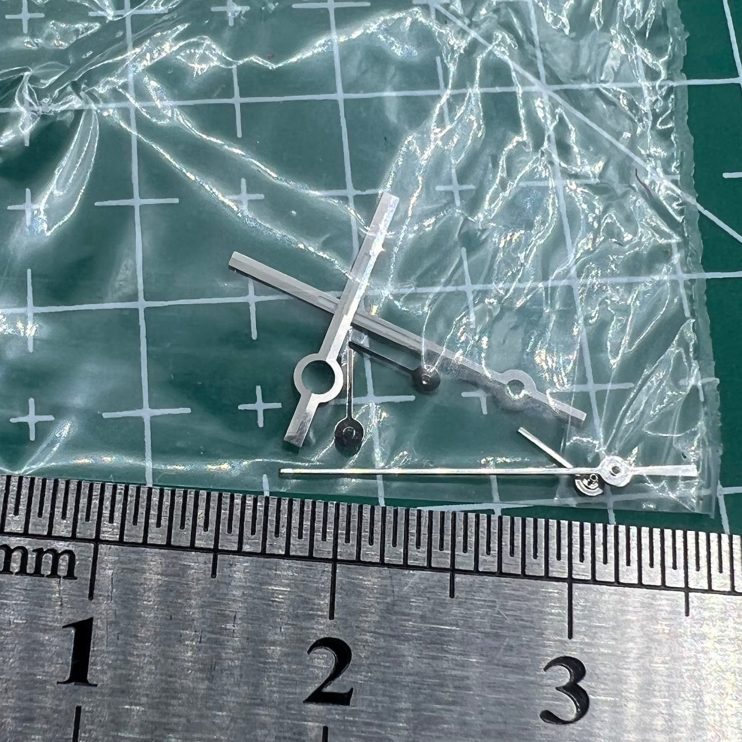 Silver watch hands with trim for Ronda 5030.D quartz movement, compatible with high-precision timepieces from leading brands.