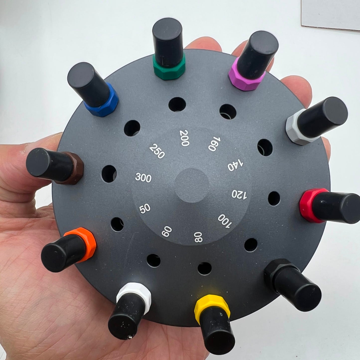 Bergeon 30081-S10 ergonomic watchmakers screwdrivers set on rotating stand for precise watch repairs and adjustments.