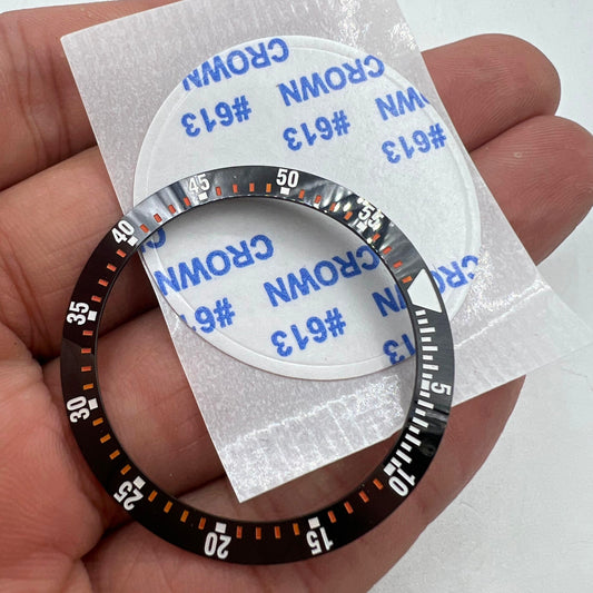38mm black ceramic bezel insert with orange graduation for watch repair and customization.