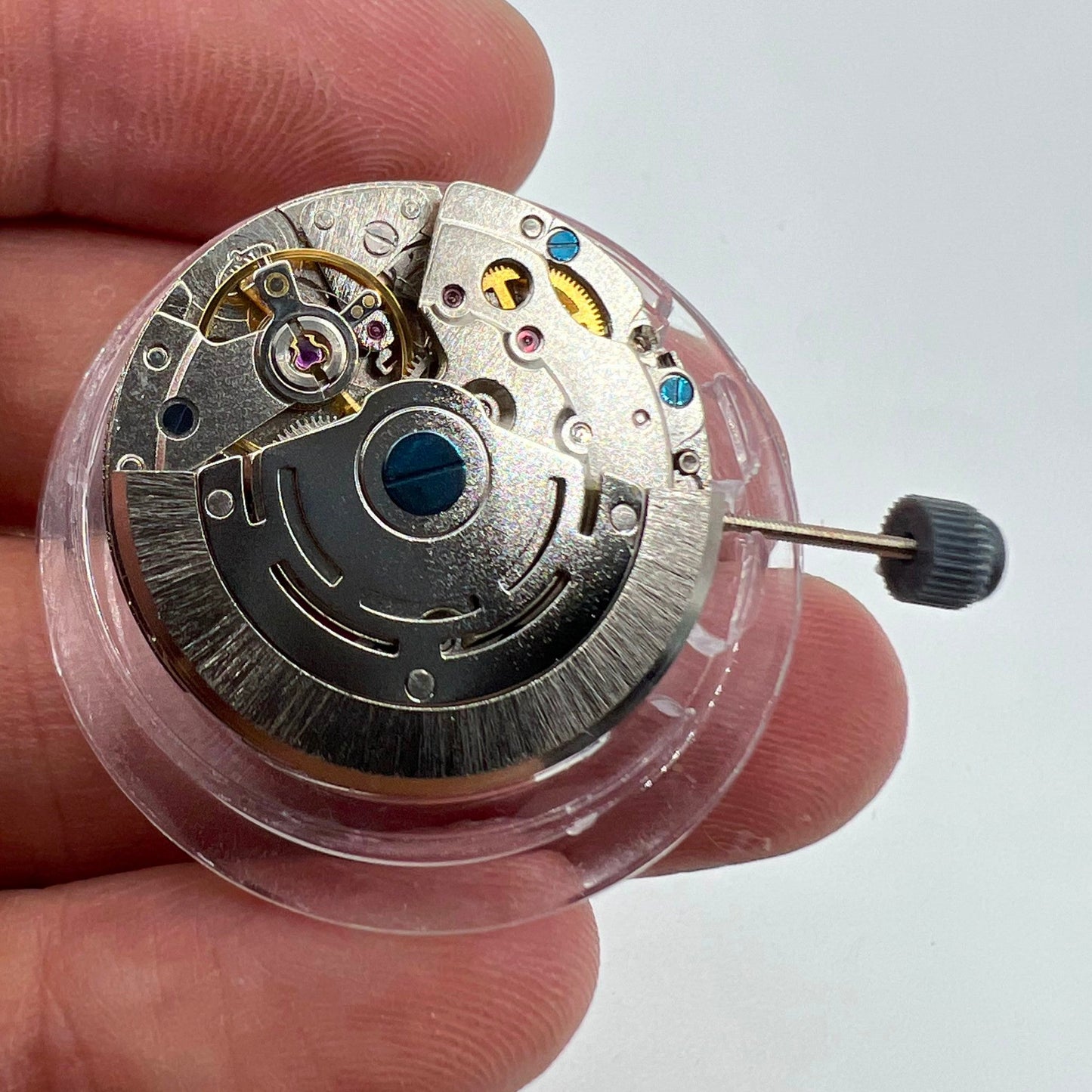 DG2813 automatic watch movement with three central hands and small seconds at 6 o'clock, no calendar.