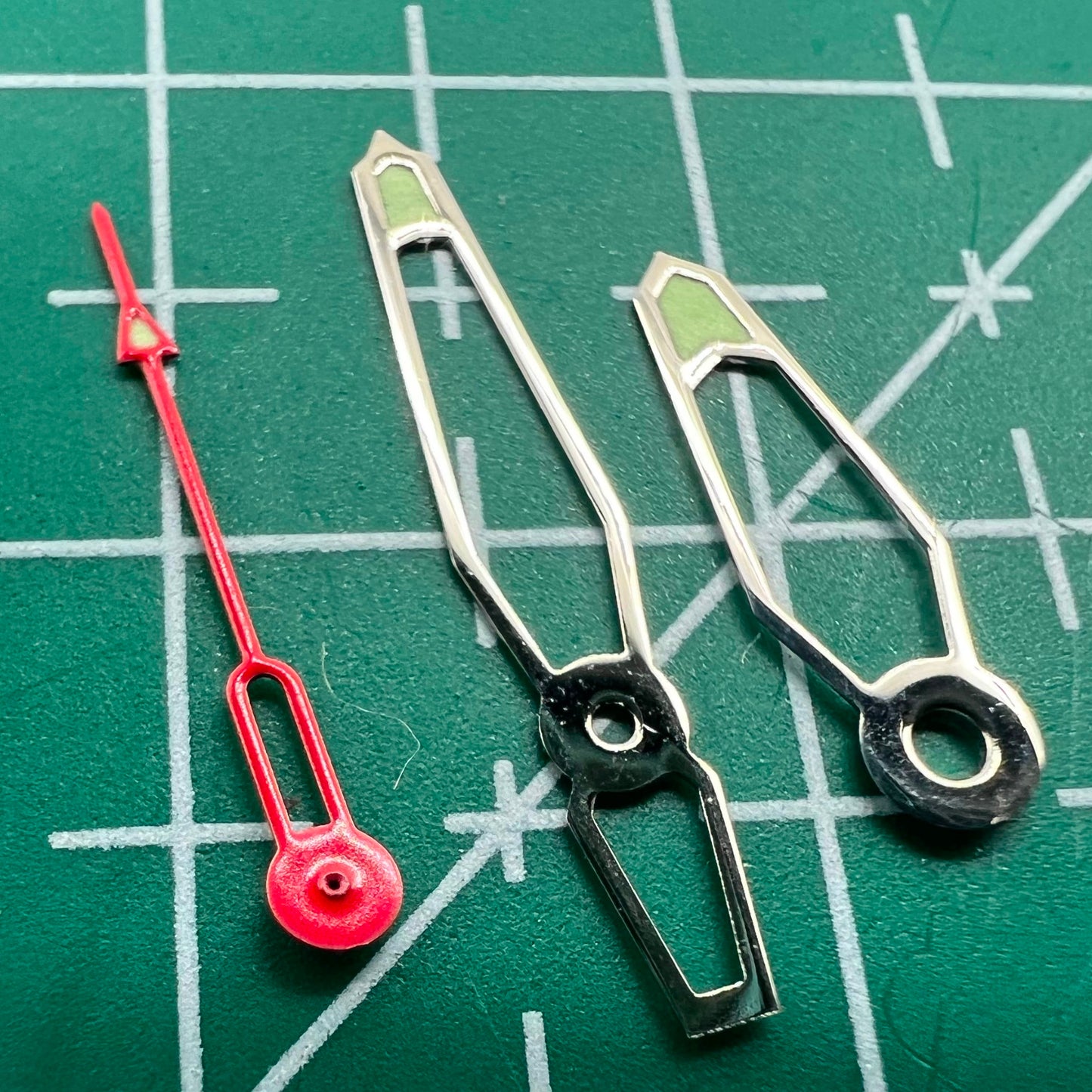 Green luminous hollow watch hands set for Miyota 2035/2115 movements, enhancing dial visibility.