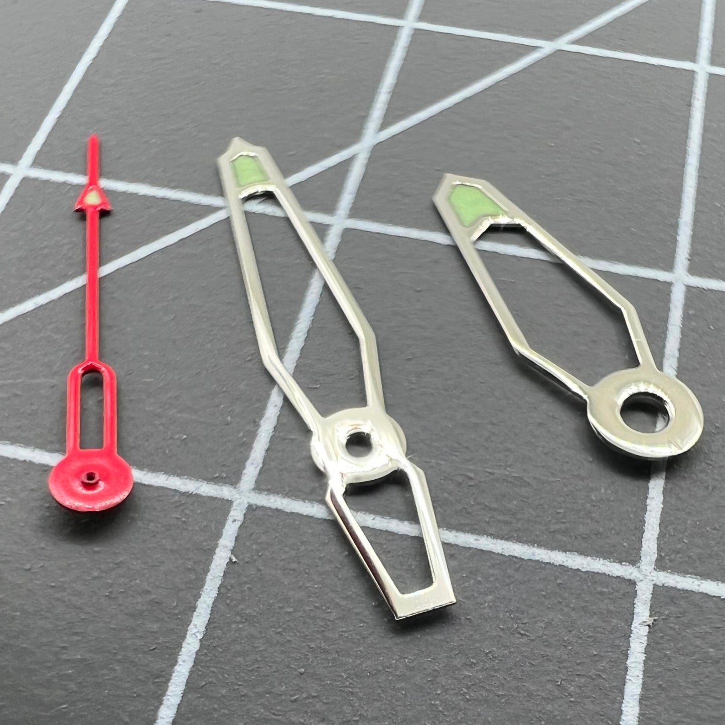 Hollow green luminous watch hands set for Miyota 2035, 2115, 2105, 2305 movements, enhancing readability in low light.
