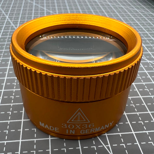 Germany Made gold 30X magnifier loupe for precise watch repair and jewelry craftsmanship.